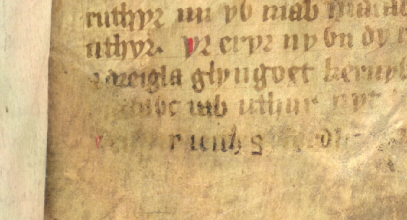 Jesus College MS 20, Folio 1r, mit schwach sichtbarem "Madawc uab uthur" ("Madoc Sohn des Uthyr") auf der vorletzten Zeile