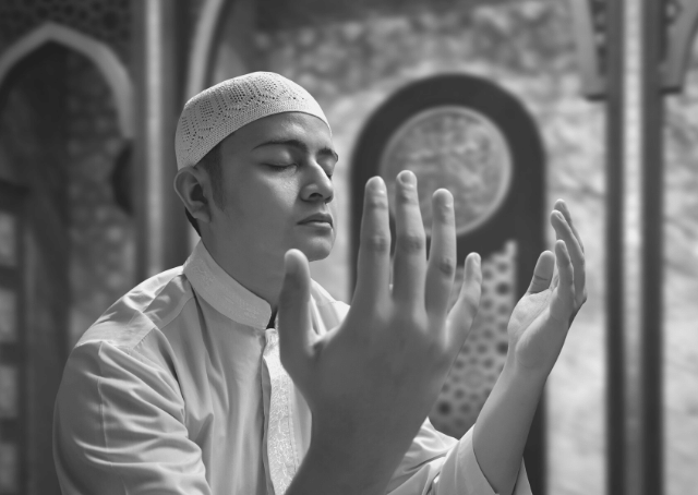 Muslim follower of Sunni Islam praying in mosque